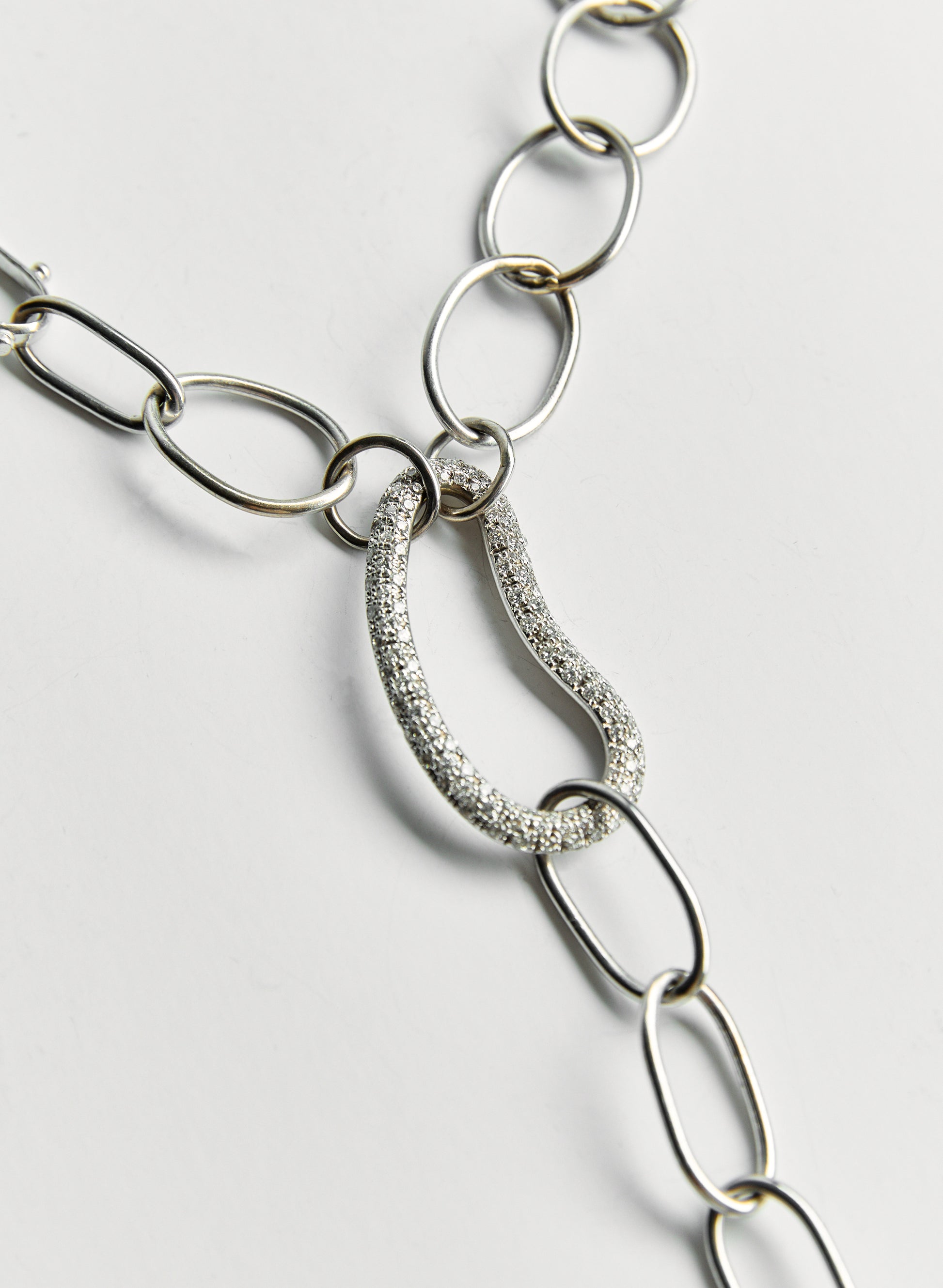 14k white gold 
Center Kidney shaped pave diamond 
